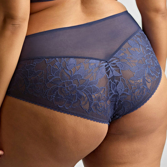 Navy blue lace underwear set on a neutral background