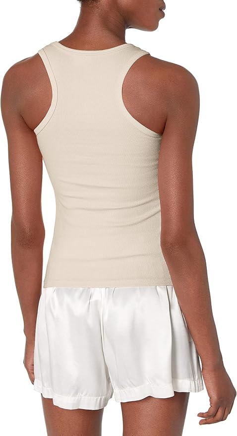 Person wearing a beige tank top and white shorts on a white background