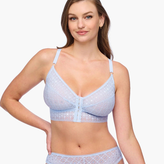 Woman wearing a light blue bikini set on a white background