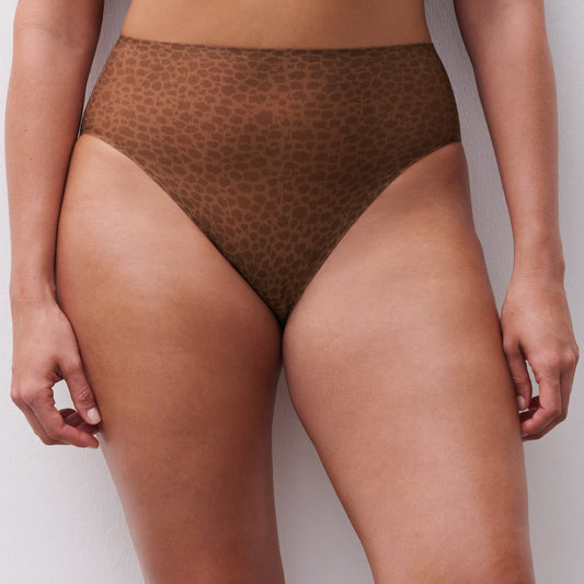 Brown patterned underwear worn by a person on a plain background