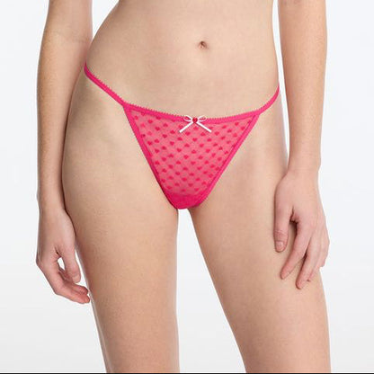 Person wearing pink fishnet lingerie on a plain background