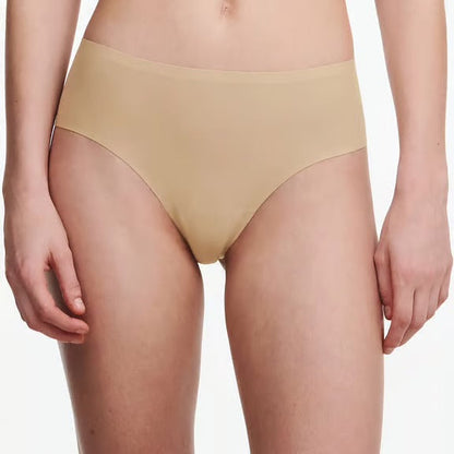 Beige underwear worn by a person on a white background