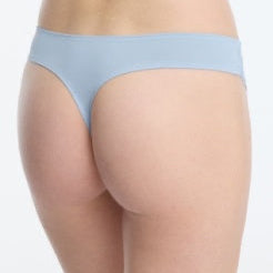 Light blue underwear worn by a person on a white background
