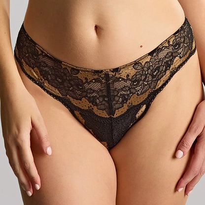 Black lace high-waisted briefs with a gold mesh lining, shown on a model from the waist to upper thighs against a light gray studio background.
