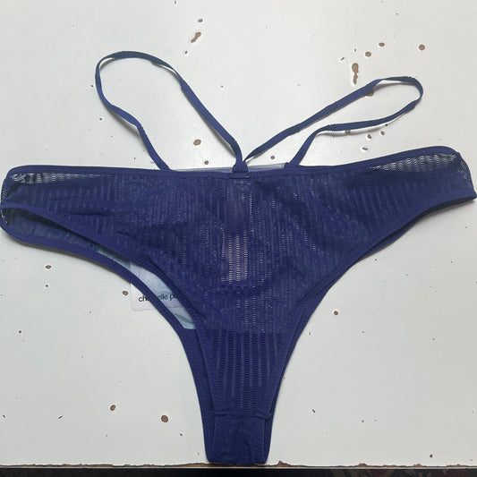 Blue thong on a white surface