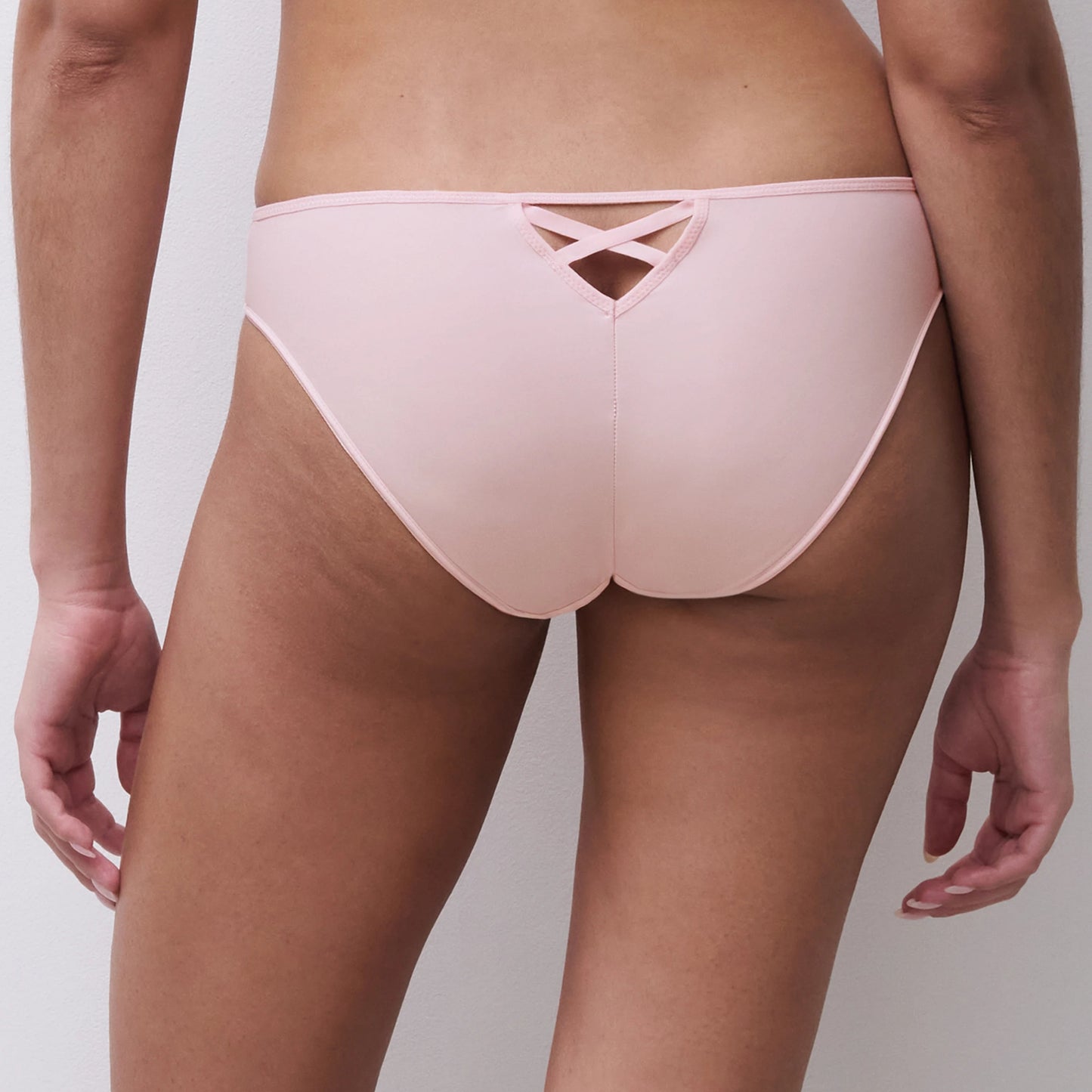 Light pink bikini bottom on a neutral background