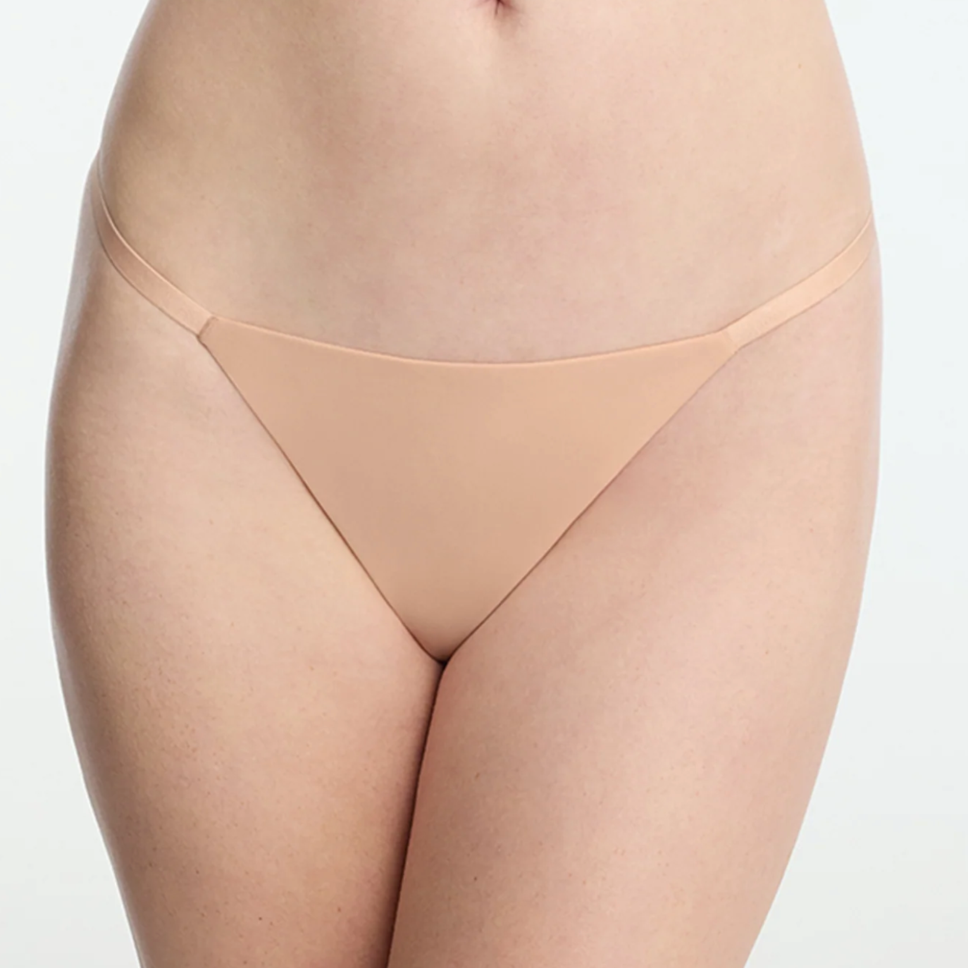 Beige thong on a white background